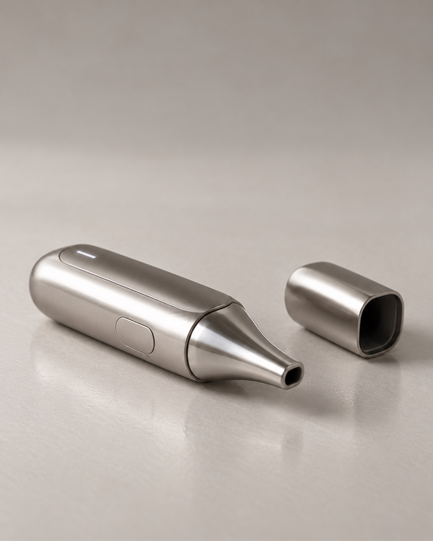 Concept render of a slim handheld nasal device with the cap off, showing the nozzle